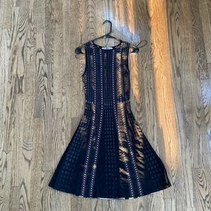 LUXE by CARMEN MARC VALVO black and nude fit and flare knit dress